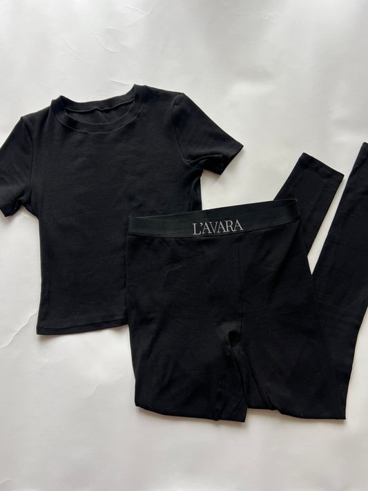 Close-up of luxe fabric texture on noir lounge set- soft and elegant